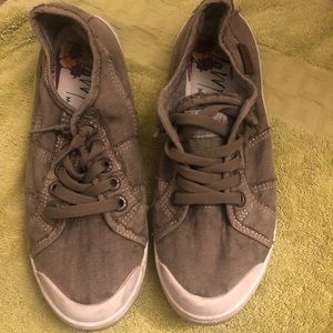 Slip on sneakers .  Color is tan/ or army green